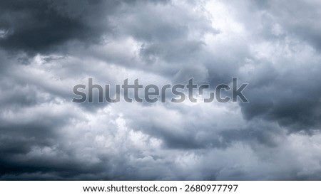 Dark dramatic sky with thunder stormy clouds before rain.  A storm is brewing. The sky is looking ominous.