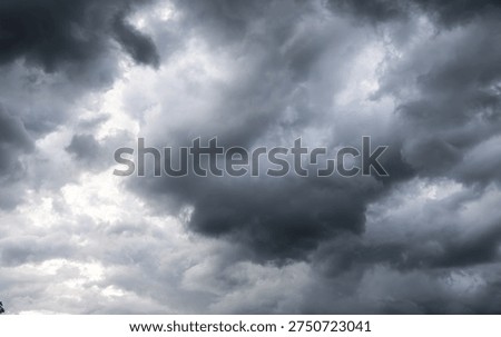 Dark dramatic sky with thunder stormy clouds before rain.  A storm is brewing. The sky is looking ominous.