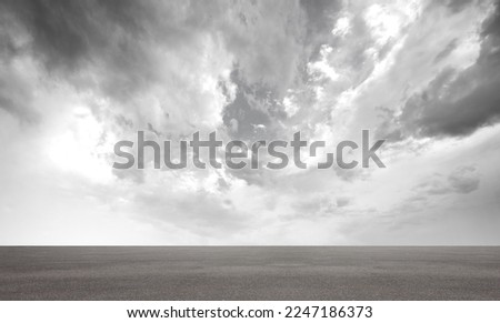 Dark Dramatic Storm Cloud Sky Backround Horizon Scene with Concrete Street Floor