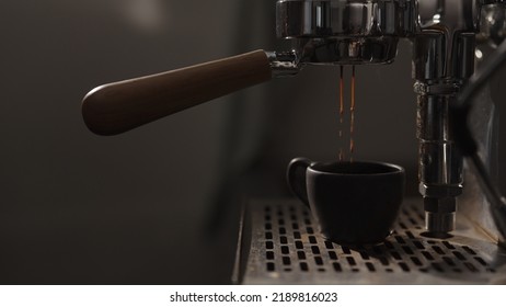 Dark Early Morning Shot Of Coffee Machine Making Esprresso, Wide Photo