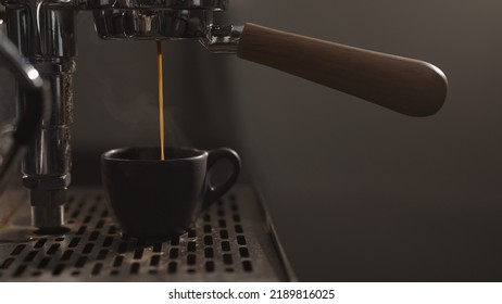 Dark Early Morning Shot Of Coffee Machine Making Esprresso, Wide Photo