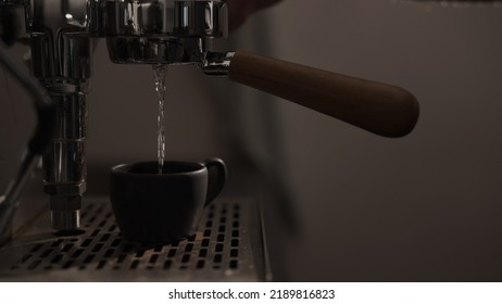 Dark Early Morning Shot Of Rinsing Coffee Machine Before Making Esprresso, Wide Photo