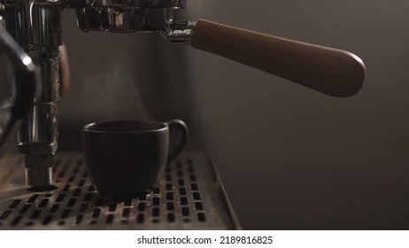 Dark Early Morning Shot Of Rinsing Coffee Machine Before Making Esprresso, Wide Photo