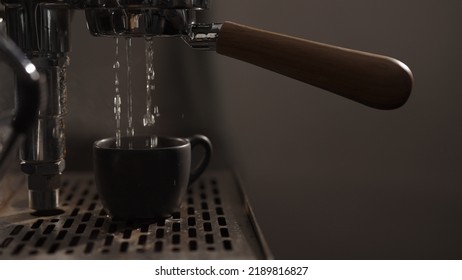 Dark Early Morning Shot Of Rinsing Coffee Machine Before Making Esprresso, Wide Photo