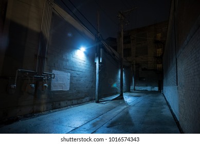 Dark And Eerie Urban City Alley At Night.