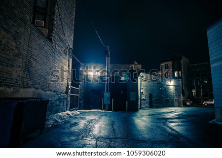 Dark and eerie urban city alley at night
