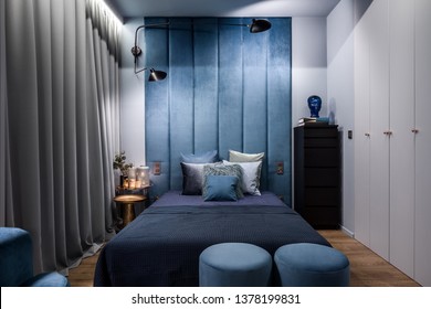 Dark And Elegant Bedroom With Double Bed And Upholstered Wall