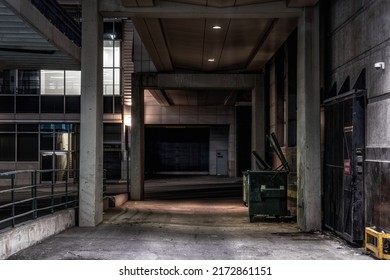 Dark empty back alley at night - Shutterstock ID 2172861151
