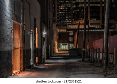 Dark empty back alley at night - Shutterstock ID 2172861521