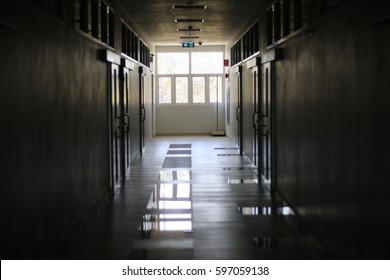 Dark Empty Corridor Hallway In Building With Light From Windows Of At School Classroom In End Of Semester.
