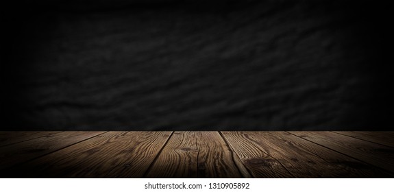 Dark empty room, wooden floor and concrete wall. Dark empty room scene. - Shutterstock ID 1310905892