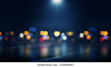 Dark Empty Stage, Multicolored Rays Of Neon Searchlight, Wet Asphalt, Smoke, Night Shooting, Bokeh Color.