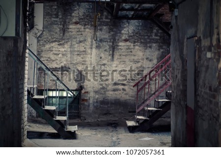 Dark empty yard with two staircases and a hanging loop. A place for suicide. The theme of suicide.