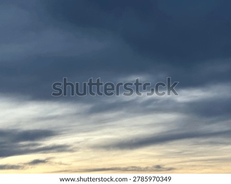Dark evening clouds over sunset sky creating dramatic natural weather background and atmospheric outdoor scene