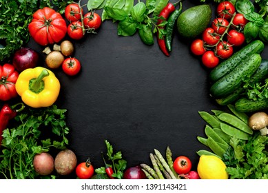 Dark flat lay culinary background with fresh produce, view from above, empty space for a text