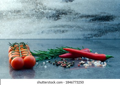 Dark food background with empty board, cherry tomatoes, rosemary, coarse himalayan salt and pepper. Free space for text or product. Copy space - Powered by Shutterstock