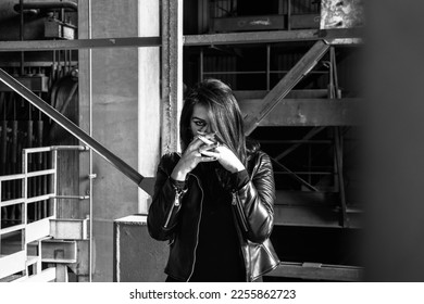 Dark girl in abandoned building, black jacket. Hands over her face. Darkness horror and halloween background concept. - Shutterstock ID 2255862723