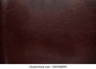 Dark glossy leather surface. Backgrounds