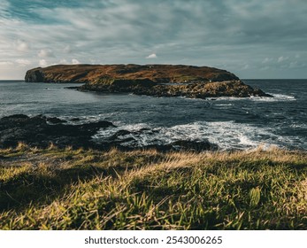 Dark gothic mysterious view over the Irish Sea and Sound to the Calf of Man from the south of the Isle of Man. Rocky cliffs, green grass and blue seas. - Powered by Shutterstock