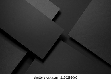 Dark graphite grey abstract textured geometric stepped background with fly rectangle paper sheets, stripe with corner, lines in hard light, black shadows in luxury business style for design, top view. - Shutterstock ID 2186292063