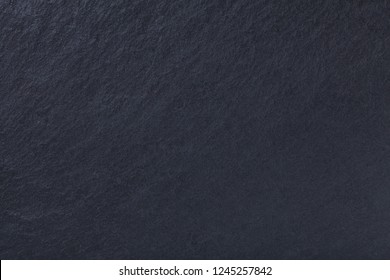 Dark Gray Background Of Natural Slate. Texture Black Stone Close Up. Graphite Backdrop Macro