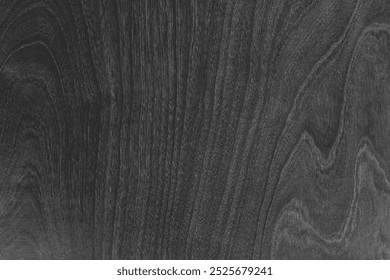 Dark gray background with wood grain texture. The background features gray color and intricate patterns for a natural, rustic look. Dark and black background. Wood texture background.