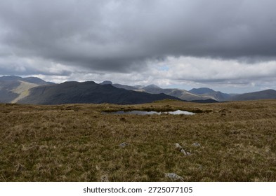 Dark gray clouds hovering over the fells of England.