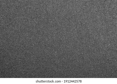 Dark Gray Denim Background.The Texture Of Black Fluted Denim.Background Of Black Jeans.