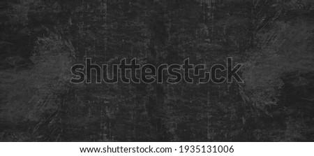 Dark gray grey anthracite black scratched damaged slate, shale natural stone concrete texture background banner