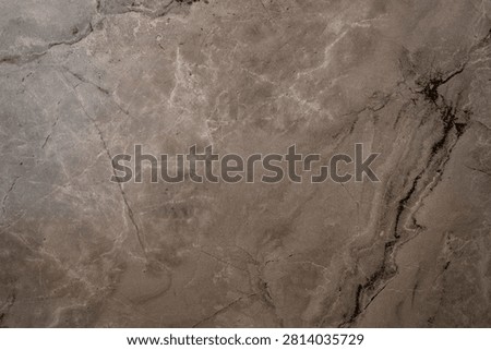 Dark gray marble stone texture with natural white and black veining patterns.
