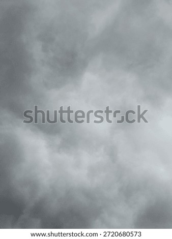 Dark gray overcast sky with dramatic clouds, natural cloudy sky background suitable for weather, mood, atmosphere, and environmental concepts.