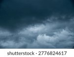 Dark gray sky cloudy environment. Meteorology danger windstorm disasters climate. Dramatic dark storm rain clouds black sky background. Dark cloudscape storm disaster gloomy gray cloud sky. Nimbus
