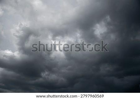 Dark gray sky cloudy environment. Meteorology danger windstorm disasters climate. Dramatic dark storm rain clouds black sky background. Dark cloudscape storm disaster gloomy gray cloud sky. Nimbus