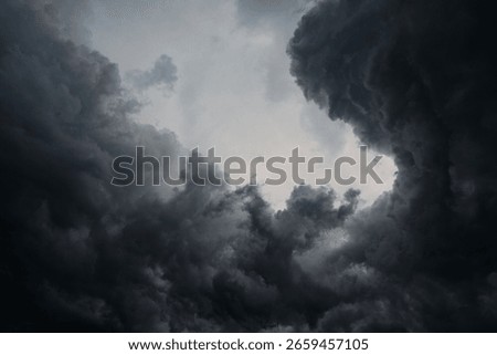 Dark gray storm clouds before the rain. Storm, darkness, death. Perfect photo for nature, climate, weather, drama and emotional background concepts.
