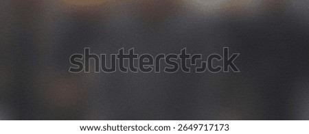 Dark gray texture creates a grainy abstract background with a rough, noisy surface and subtle color variations.