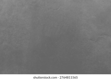 Dark gray textured background with subtle cracks and a smooth, stone-like appearance, creating a rugged and industrial feel.