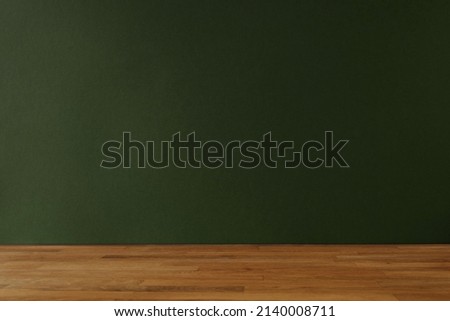 Dark green background for copy space and wooden table