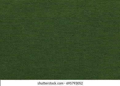 Dark green background from a textile material with wicker pattern, closeup. Structure of the olive fabric with natural texture. Cloth backdrop.