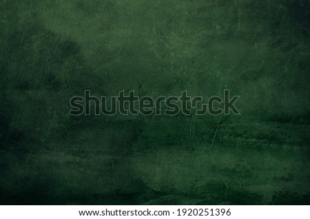 Dark green canvas grungy background or texture 