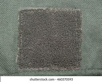 dark green cloth khaki on which is sewn a Velcro , close up