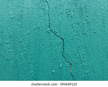 Dark green concrete crack wall texture background