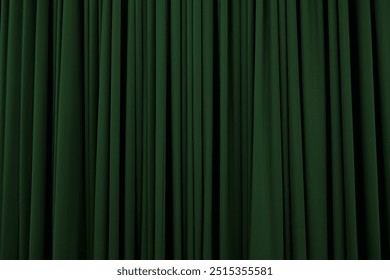 Dark green curtain with many folds background texture