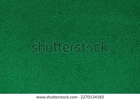 Dark green glitter background. Green texture.	