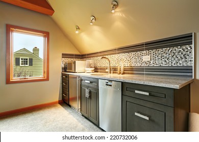 Dark Green Kitchen Cabinets With Back Splash Trim, Steel Appliances In Small Room With Vaulted Ceiling