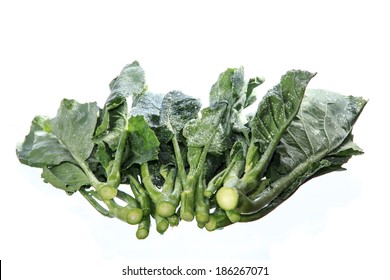 Dark Green Leafy Fresh Vegetables On White Background