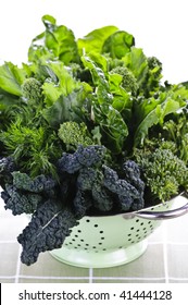 Dark Green Leafy Fresh Vegetables In Metal Colander