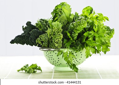 Dark Green Leafy Fresh Vegetables In Metal Colander