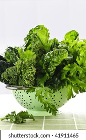 Dark Green Leafy Fresh Vegetables In Metal Colander