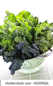 Dark Green Leafy Fresh Vegetables In Metal Colander