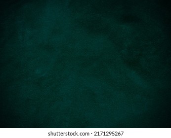 Dark green old velvet fabric texture used as background. Empty green fabric background of soft and smooth textile material. There is space for text.	